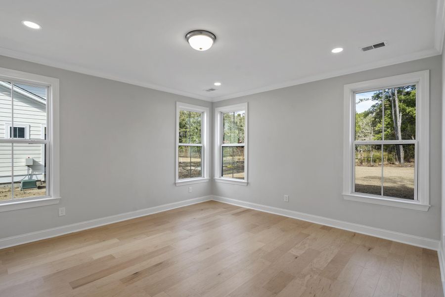 Spacious, unfurnished interior of a new home in K. Hovnanian's® Four Seasons at Lakes of Cane Bay, Summerville (Image 16).