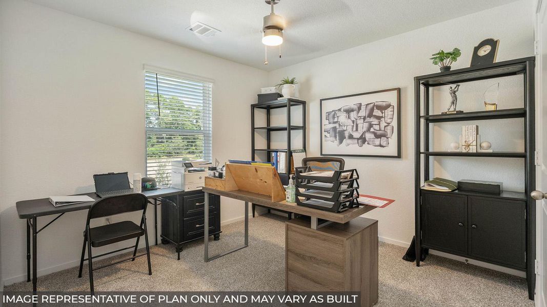 Bright room featuring a ceiling fan with integrated lighting, light neutral wall paint, and textural carpeting