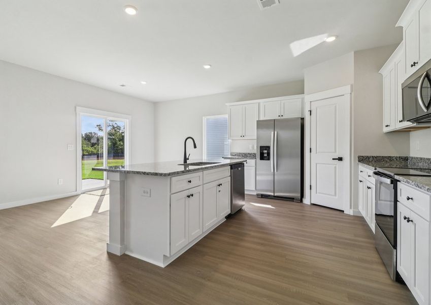 The kitchen has designer wood cabinetry The kitchen has designer wood cabinetry