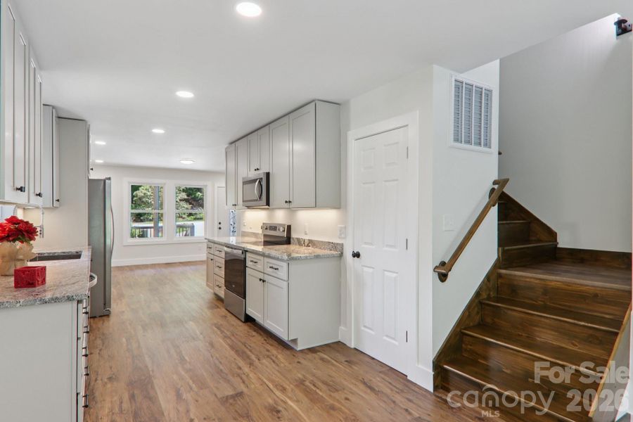 Furnished interior view inside a new home in , Waynesville (Image 8).
