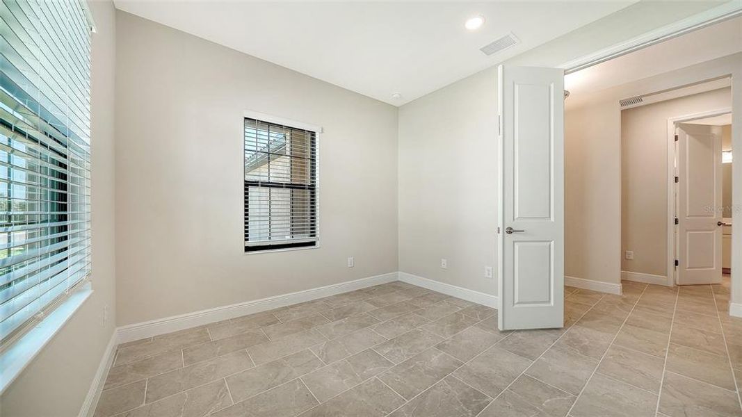 Spacious, unfurnished interior of a new home in Vicenza Real Estate and Homes for Sale in North Venice, FL - Neal Communities, Nokomis (Image 34).