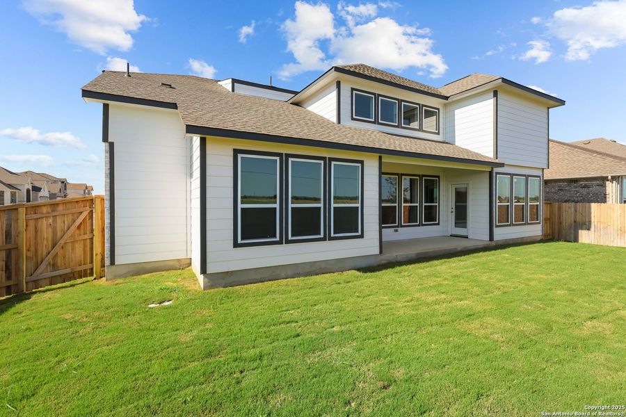 Front exterior of a new home in Megan's Landing 50', Castroville, TX, highlighting curb appeal (Image 17).