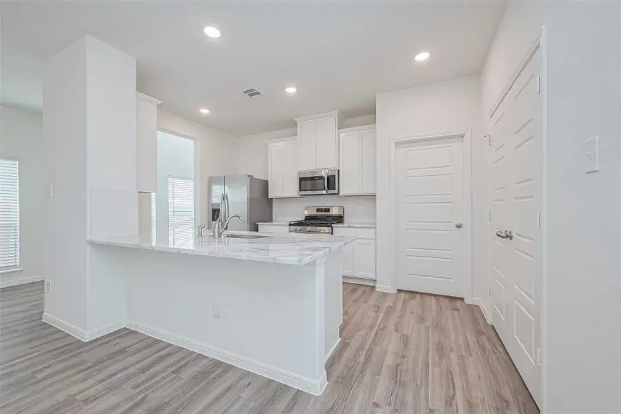 Furnished interior view inside a new home in Enclave at Willis, Willis (Image 11).