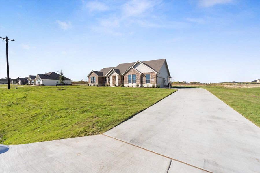 Front exterior of a new home in Clear Sky Addition, Valley View, TX, highlighting curb appeal (Image 25).
