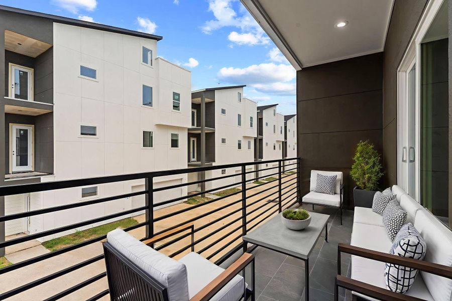 Soft recessed lighting sets the mood on this inviting balcony, virtually staged to highlight its potential for evening lounging, morning coffee, or open-air entertaining