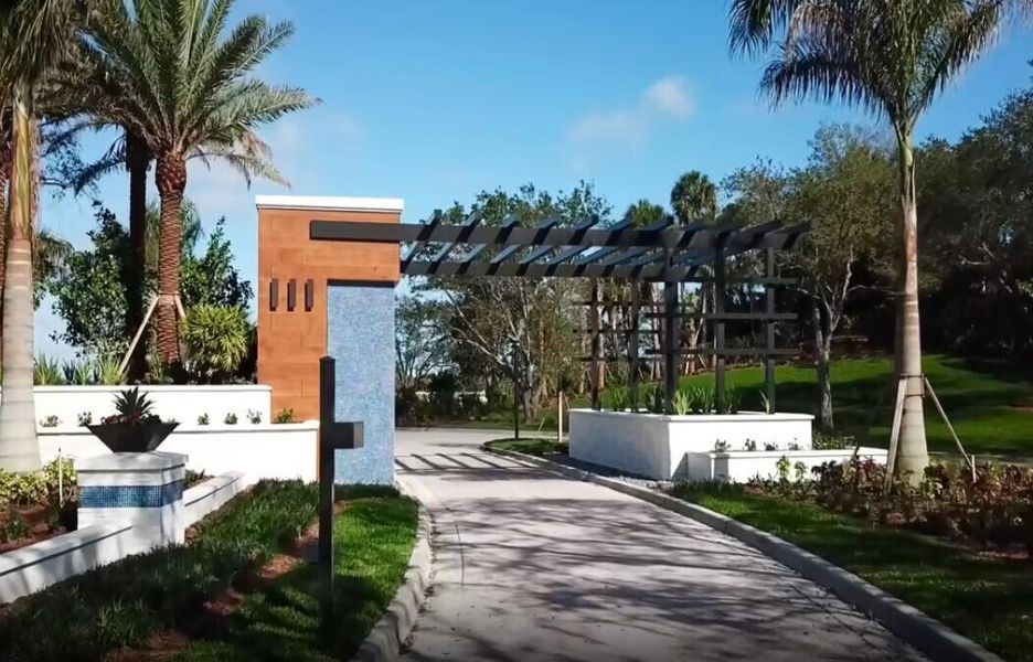 Front exterior of a new home in Bridgewater, Jupiter, FL, highlighting curb appeal (Image 1).