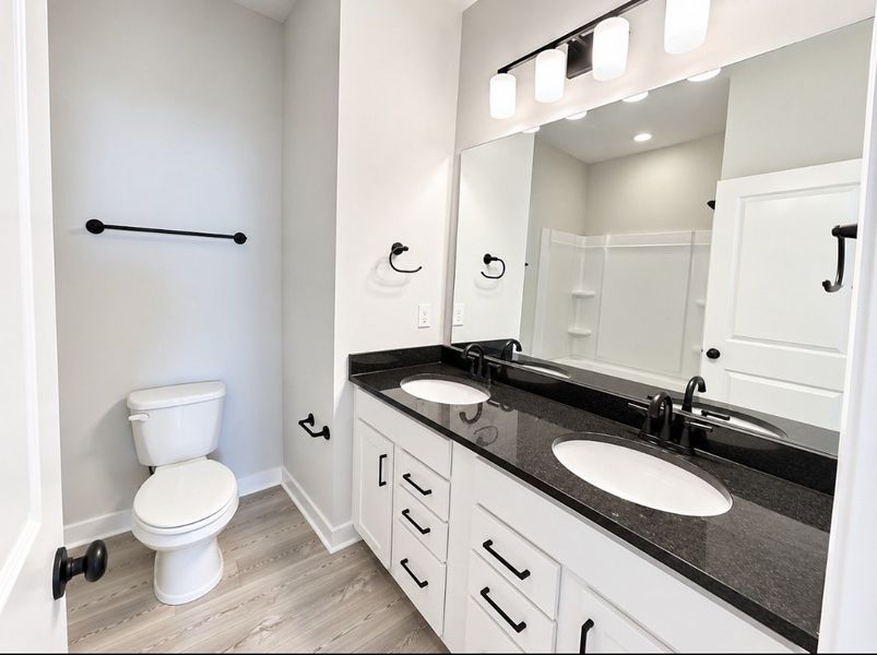 Furnished interior view inside a new home in Hickory Cove, Burns (Image 13).