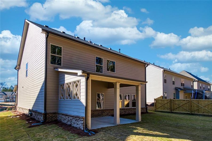 Exterior details and patio area of a home in Enclave at Logan Point, Loganville (Image 20).