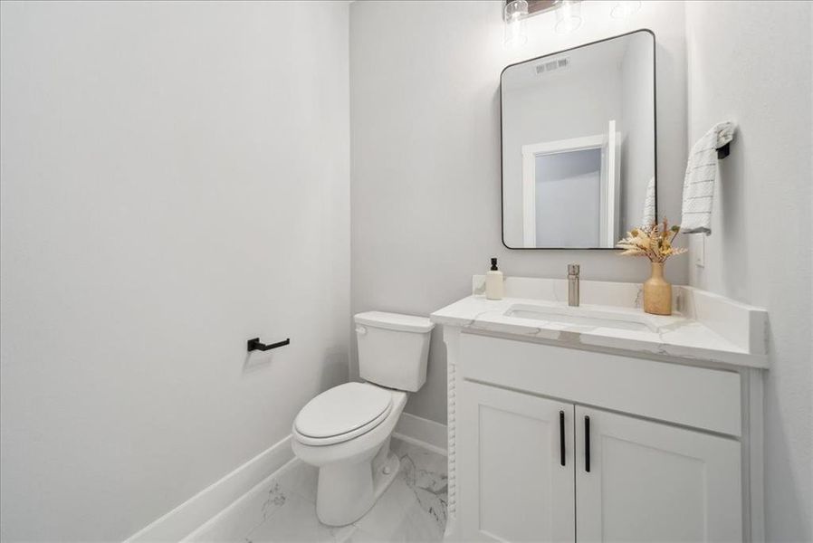 Bathroom featuring toilet and vanity