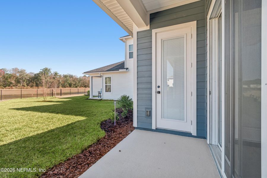 Exterior details and patio area of a home in Granville at eTown 38', Jacksonville (Image 3). Exterior details and patio area of a home in Granville at eTown 38', Jacksonville (Image 3).