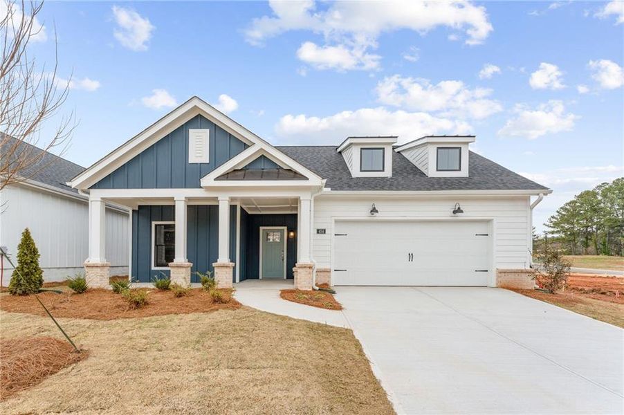 Front exterior of a new home in The Courtyards at Redbud Lane, Holly Springs, GA, highlighting curb appeal (Image 2). Front exterior of a new home in The Courtyards at Redbud Lane, Holly Springs, GA, highlighting curb appeal (Image 2).