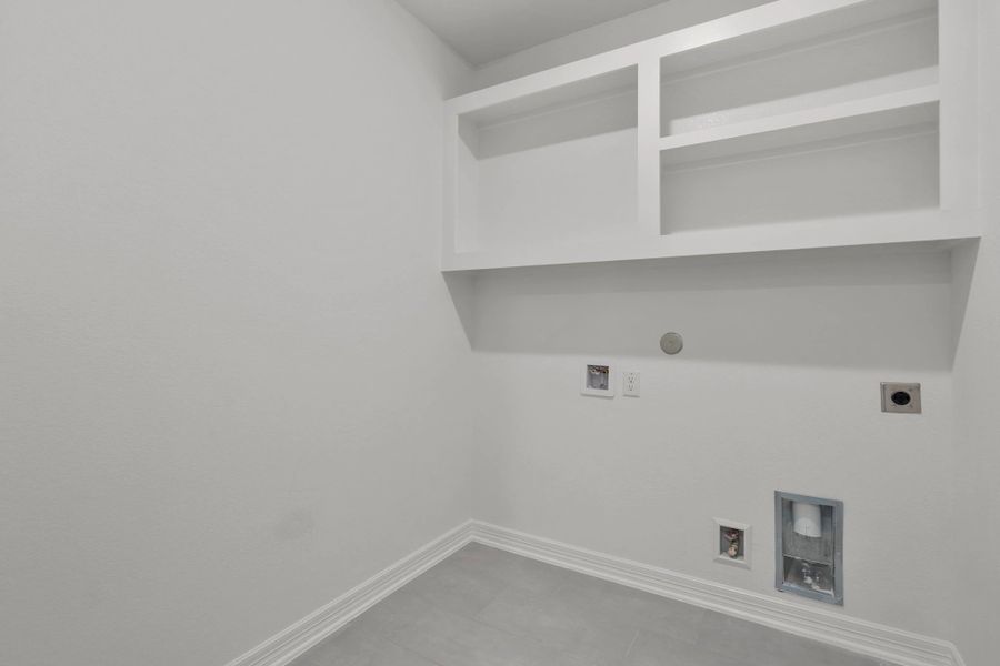 Laundry room.  Sample product photo. Actual exterior and interior selections may vary by homesite. Photo may be virtually staged.