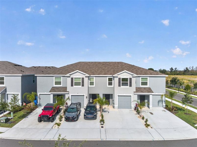 Front exterior of a new home in Mangrove Point, Apollo Beach, FL, highlighting curb appeal (Image 25).