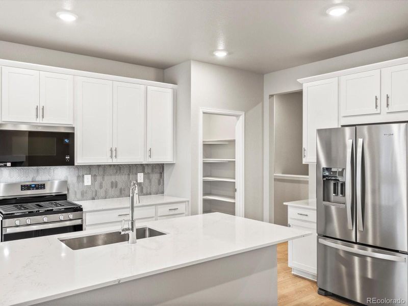 Furnished interior view inside a new home in Poudre Heights: The Alpine Collection, Windsor (Image 10).