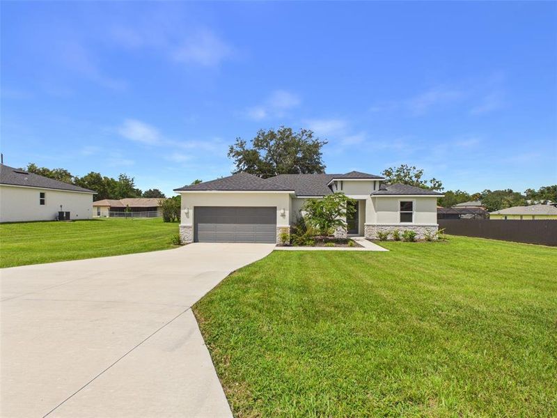 Front exterior of a new home in Ocala, Ocala, FL, highlighting curb appeal (Image 2). Front exterior of a new home in Ocala, Ocala, FL, highlighting curb appeal (Image 2).