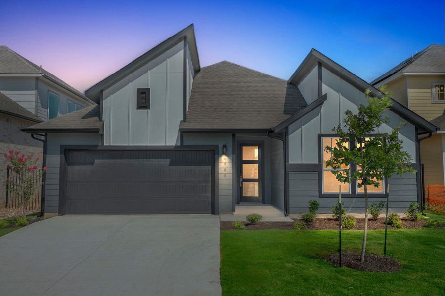 View of front of house with board and batten siding, concrete driveway, roof with shingles, a lawn, and a garage View of front of house with board and batten siding, concrete driveway, roof with shingles, a lawn, and a garage