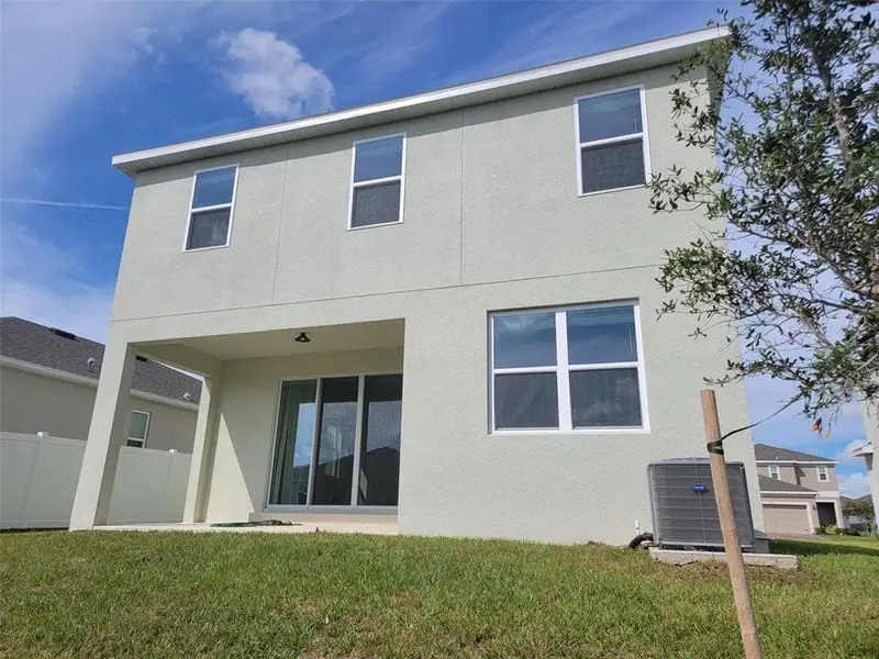 Exterior details and patio area of a home in Trinity Lakes, Groveland (Image 3).