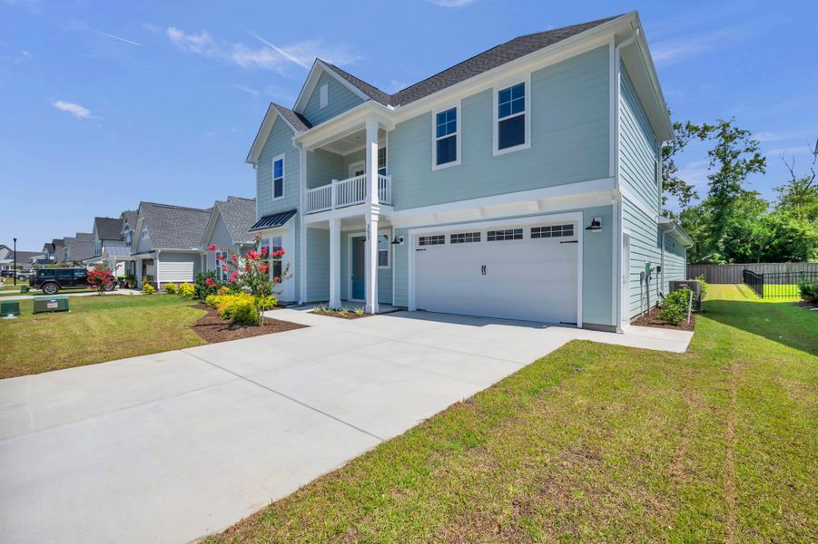 Representative exterior photo of a completed home built from the The Highland by RobuckHomes in WyndWater, Hampstead, NC (Image 26). Representative exterior photo of a completed home built from the The Highland by RobuckHomes in WyndWater, Hampstead, NC (Image 26).