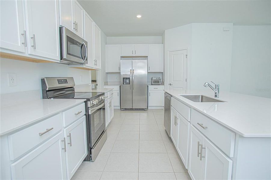 Furnished interior view inside a new home in Tohoqua, Kissimmee (Image 6).