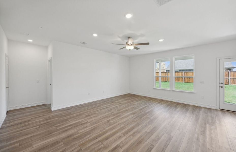 Sunbathed gathering room with expansive windows