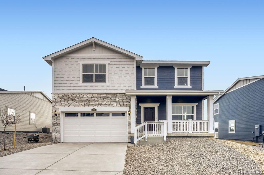 Front exterior of a new home in Ledge Rock, Johnstown, CO, highlighting curb appeal (Image 1). Front exterior of a new home in Ledge Rock, Johnstown, CO, highlighting curb appeal (Image 1).