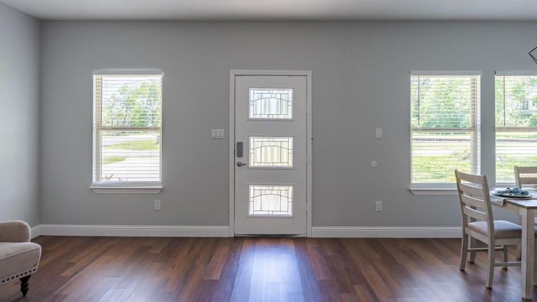 Foyer entrance featuring dark wood-type flooring Foyer entrance featuring dark wood-type flooring