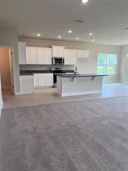 Furnished interior view inside a new home in Harmony Central, Harmony (Image 5).