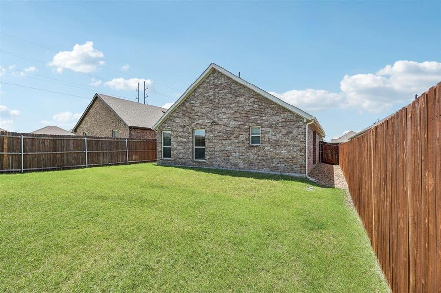 Front exterior of a new home in , Lavon, TX, highlighting curb appeal (Image 15). Front exterior of a new home in , Lavon, TX, highlighting curb appeal (Image 15).