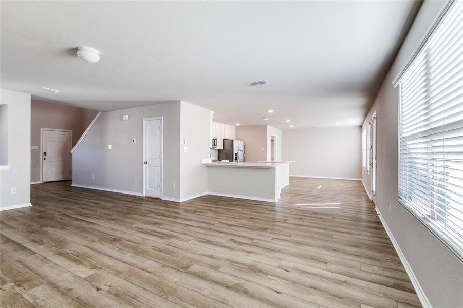 Unfurnished living room featuring light hardwood / wood-style flooring