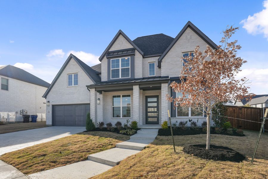 Front exterior of a new home in Estates at Rockhill, Frisco, TX, highlighting curb appeal (Image 26). Front exterior of a new home in Estates at Rockhill, Frisco, TX, highlighting curb appeal (Image 26).