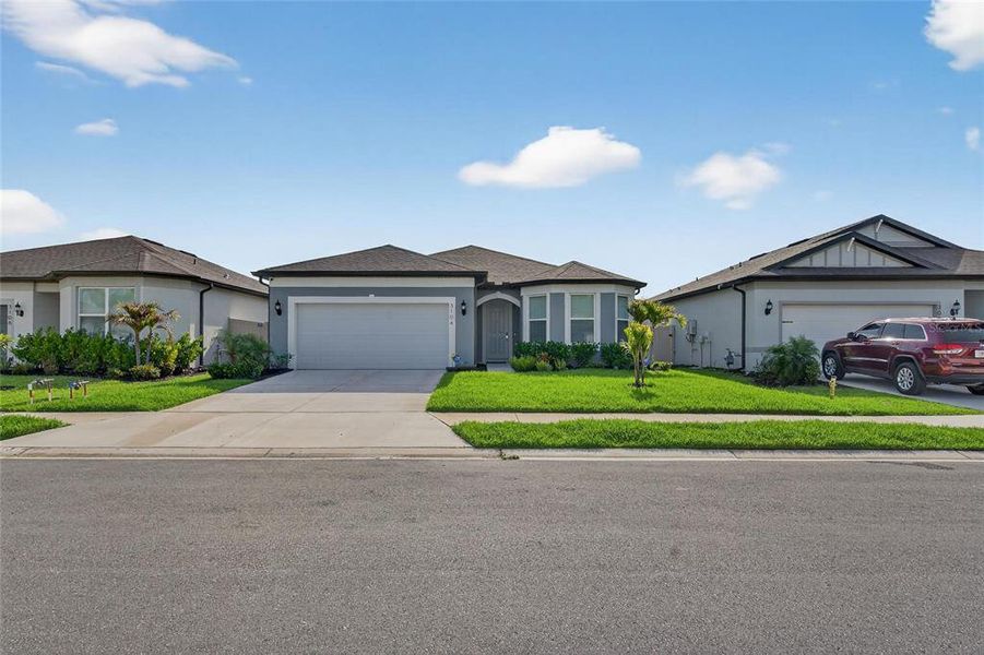 Front exterior of a new home in , Ellenton, FL, highlighting curb appeal (Image 34).