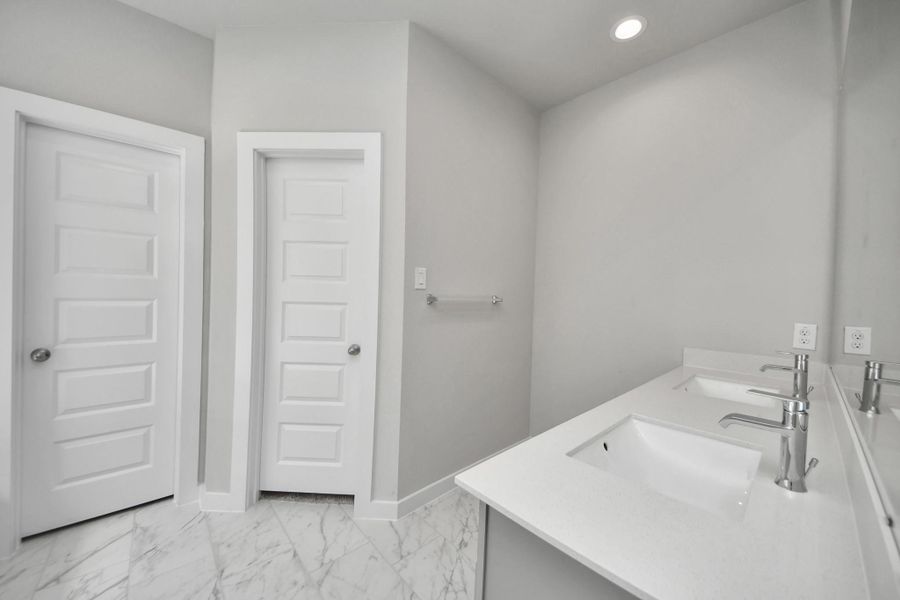 Experience a spa-like escape right in the heart of your primary bathroom. The expansive walk-in shower, surrounded by tile, and the distinctive garden tub with unique accents elevate your daily routine. Sample photo of completed home with similar floor plan. Actual colors and selections may vary. Experience a spa-like escape right in the heart of your primary bathroom. The expansive walk-in shower, surrounded by tile, and the distinctive garden tub with unique accents elevate your daily routine. Sample photo of completed home with similar floor plan. Actual colors and selections may vary.