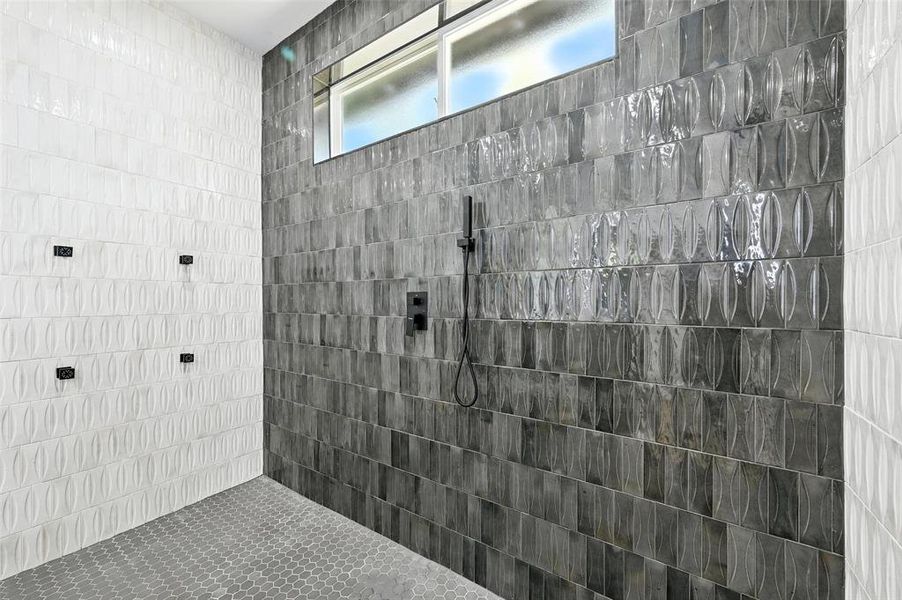 Full bath featuring a walk in shower Full bath featuring a walk in shower