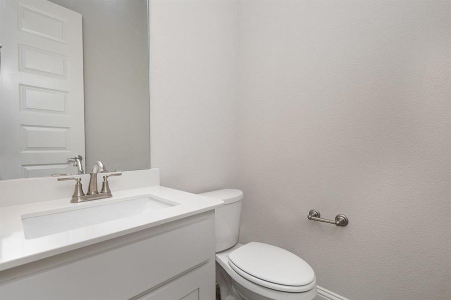 Bathroom featuring vanity and toilet