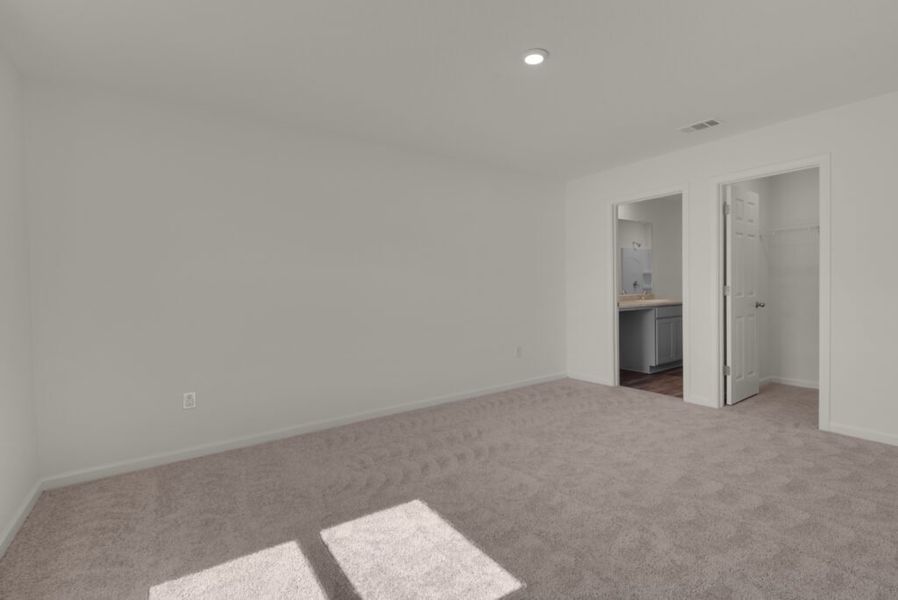 Representative unfurnished interior of a home built from the Maddox by Holiday Builders in Floridatown, Pace (Image 7).