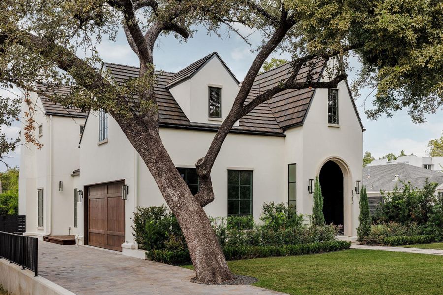 A statement of timeless architecture and modern sophistication, the stucco and concrete-tile roof captures the essence of Old Enfield elegance with crisp, balanced lines and lush landscaping. A statement of timeless architecture and modern sophistication, the stucco and concrete-tile roof captures the essence of Old Enfield elegance with crisp, balanced lines and lush landscaping.