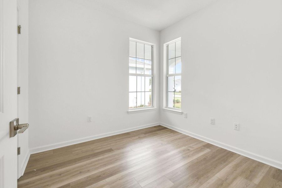 Front exterior of a new home in Costa Pointe, Vero Beach, FL, highlighting curb appeal (Image 22). Front exterior of a new home in Costa Pointe, Vero Beach, FL, highlighting curb appeal (Image 22).