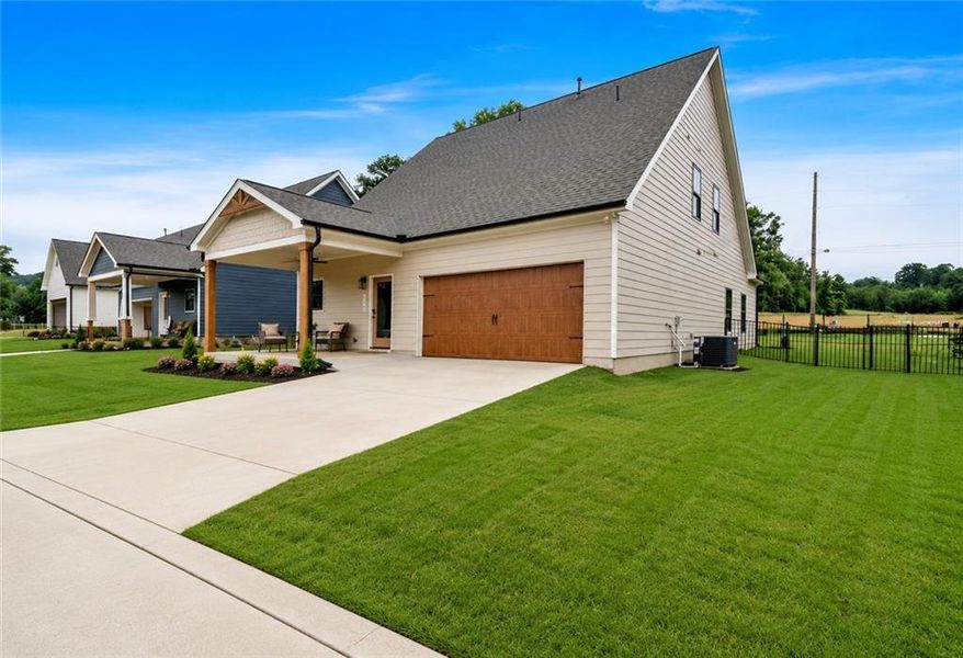 Front exterior of a new home in Ferguson Corners, Emerson, GA, highlighting curb appeal (Image 25). Front exterior of a new home in Ferguson Corners, Emerson, GA, highlighting curb appeal (Image 25).