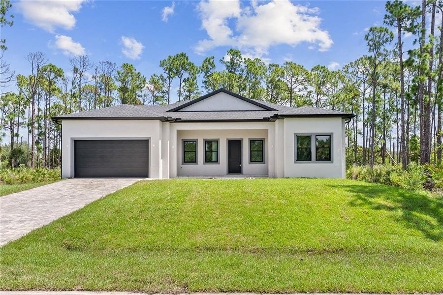 Front exterior of a new home in , Port Charlotte, FL, highlighting curb appeal (Image 31). Front exterior of a new home in , Port Charlotte, FL, highlighting curb appeal (Image 31).