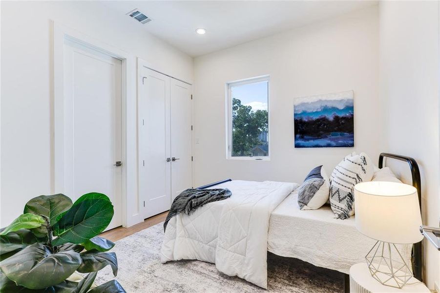 Bedroom featuring wood-type flooring