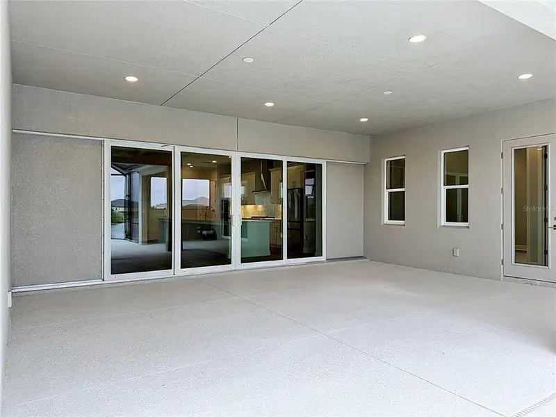 Exterior details and patio area of a home in River Preserve Estates, Parrish (Image 2).