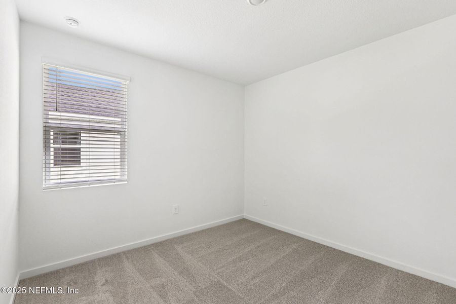 Spacious, unfurnished interior of a new home in Lakes at Bella Lago - Signature Series, Green Cove Springs (Image 25).