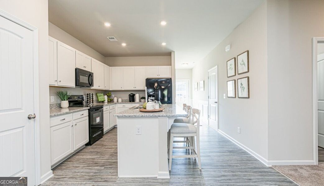 Furnished interior view inside a new home in The Cottages of Silvertown, Thomaston (Image 14).