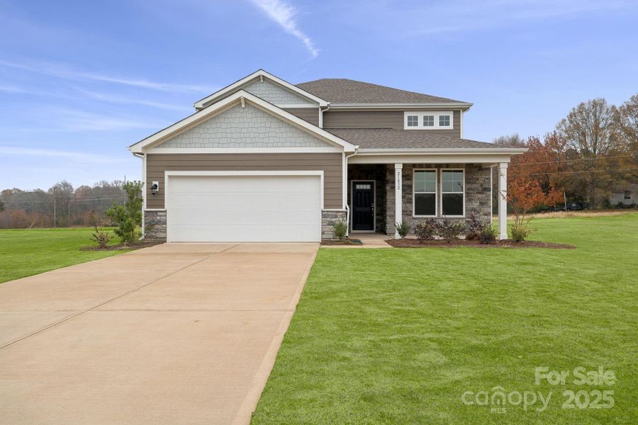 Front exterior of a new home in Running Creek, Locust, NC, highlighting curb appeal (Image 2). Front exterior of a new home in Running Creek, Locust, NC, highlighting curb appeal (Image 2).