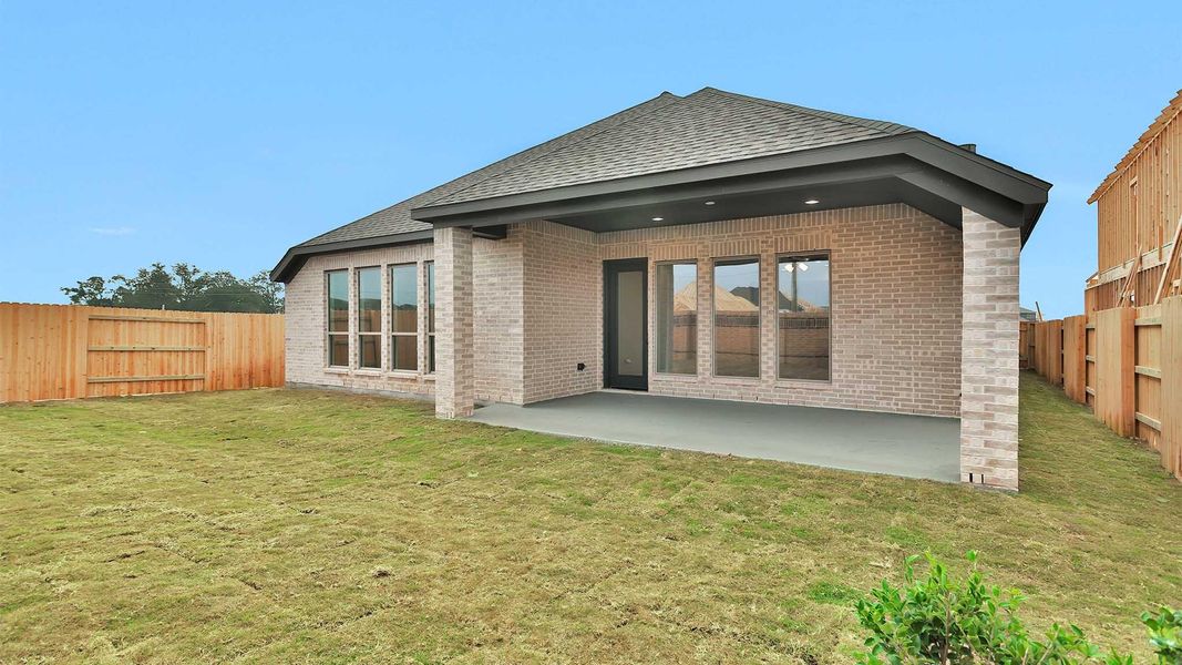 Exterior details and patio area of a home in Elyson 55', Katy (Image 4).