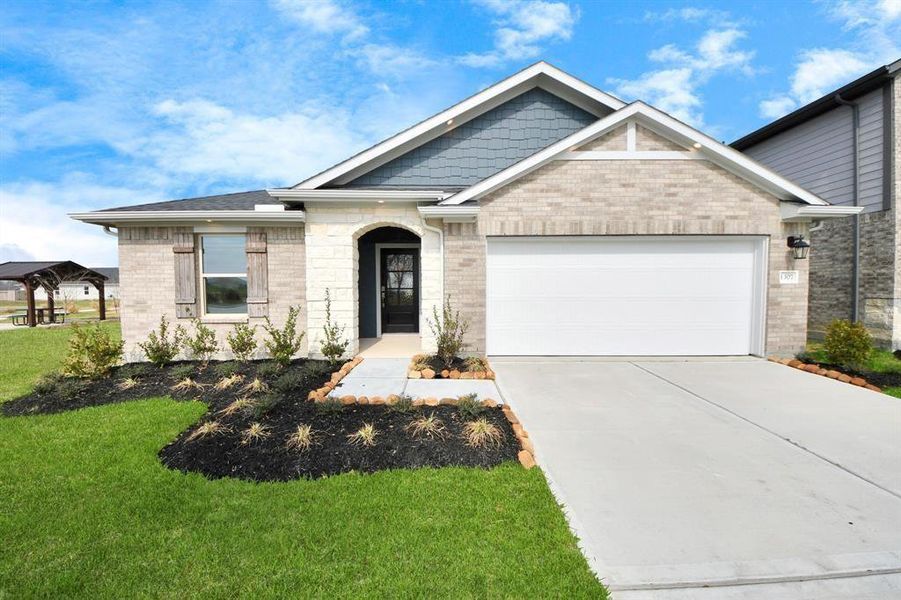 Front exterior of a new home in Sweetgrass Village, Crosby, TX, highlighting curb appeal (Image 2).
