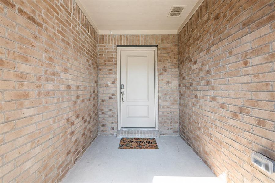 Bedroom featuring light carpet and baseboards Bedroom featuring light carpet and baseboards