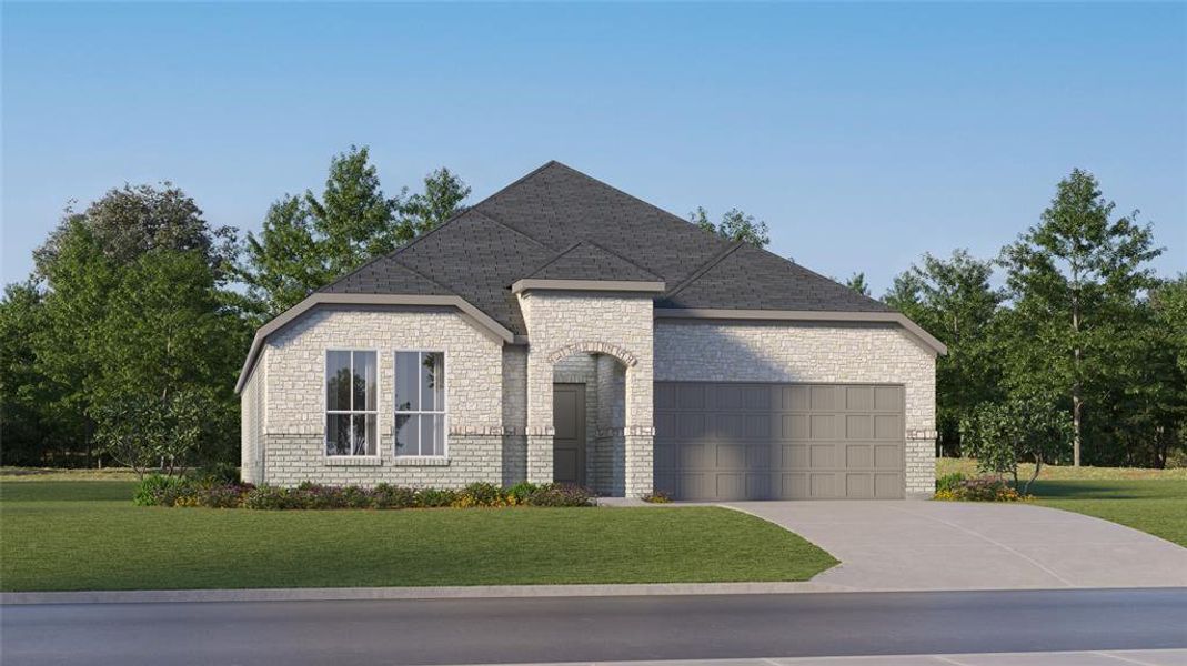 View of front of house featuring a front yard and a garage