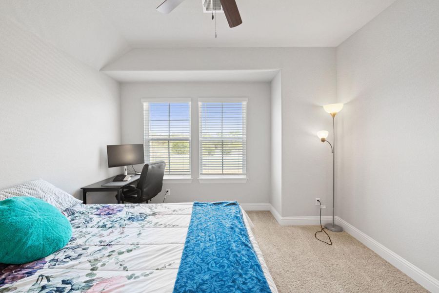 Bedroom with light carpet and ceiling fan Bedroom with light carpet and ceiling fan