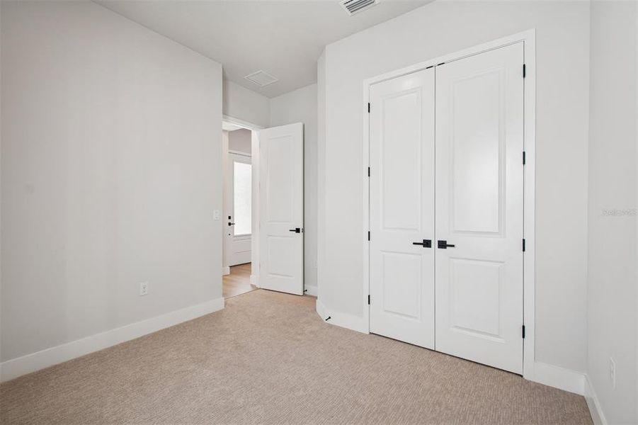 Spacious, unfurnished interior of a new home in Emerald Landing at Waterside at Lakewood Ranch – Lake Series, Sarasota (Image 27).